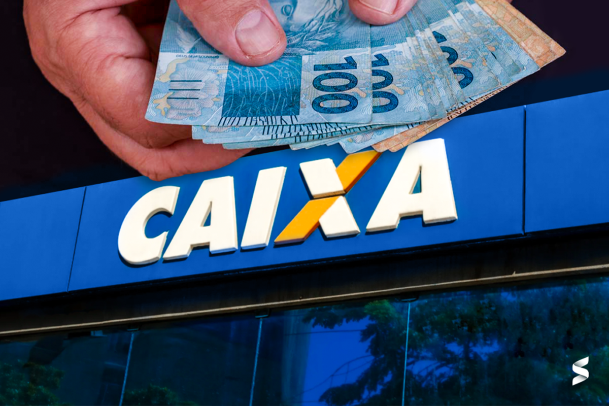 Pessoa retirando dinheiro de uma agência da Caixa Econômica Federal.