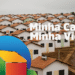 Casas populares do programa Minha Casa Minha Vida, junto a inscrição do programa.