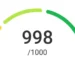 Pontuação de crédito de 998 de 1000, representada em gráfico de medidor, indicando excelente saúde financeira.