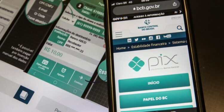 Imagem mostrando um celular com a interface de pagamento Pix, uma plataforma do Banco Central do Brasil, com detalhes de transferência e segurança, uma alerta sobre o golpe do Pix errado.