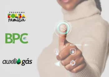 Imagem de digital sendo escaneada com interfaces de tecnologia, relacionada à biometria para programas sociais como Bolsa Família, BPC e Auxílio Gás.