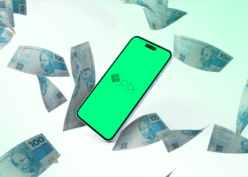 Celular com tela verde exibindo logotipo do PIX rodeado por notas de cem reais flutuando