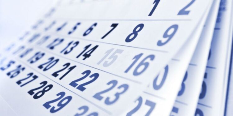 Calendário de setembro com datas de feriados em destaque.