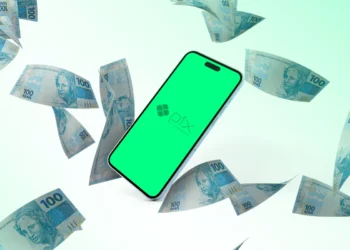 Celular exibindo a logo do Pix com notas de real ao redor, simbolizando transferências digitais rápidas e seguras.