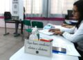 Mesa de atendimento eleitoral em local de votação