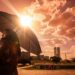 Mulher negra segura guarda-chuva sob sol intenso com termômetro marcando 43°C e Congresso Nacional ao fundo em Brasília