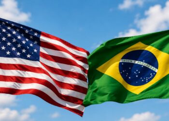 Imagem ilustrativa das bandeiras dos Estados Unidos e do Brasil lado a lado, representando o impasse comercial gerado pela nova sobretaxa sobre as exportações brasileiras