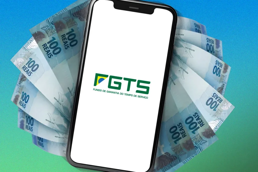 Celular com símbolo do FGTS e notas de real ao fundo representam o processo de retirada do saque-aniversário pelo trabalhador.